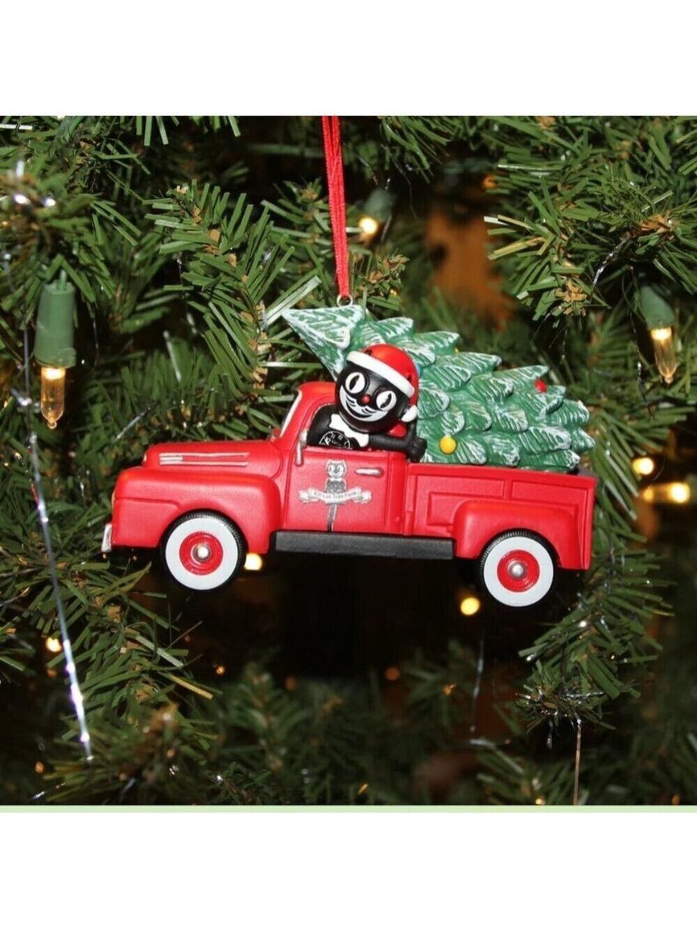 Kit-Cat Klock driving a red truck Christmas Ornament